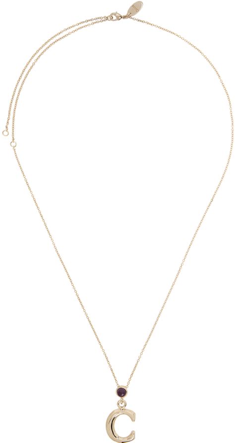 Chloé: Gold Alphabet Pendant C Necklace .